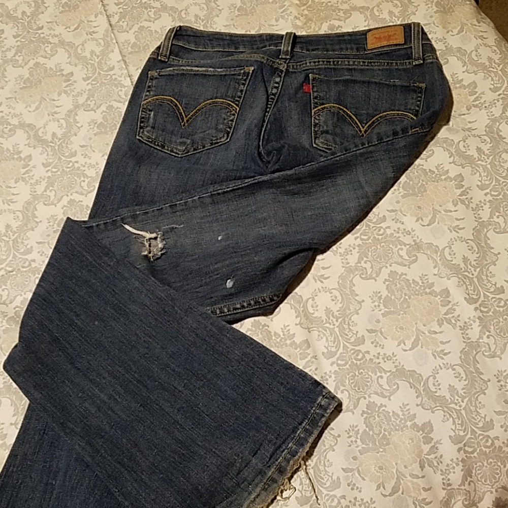 Boot cut Jean's with a bit of whit paint